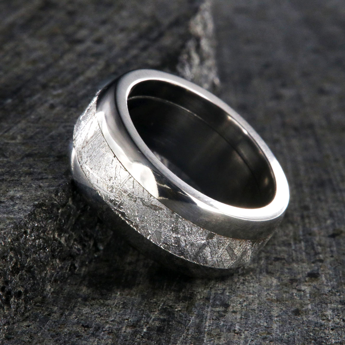 8mm wide Muonionalusta meteorite wedding band with titanium edges and sleeve