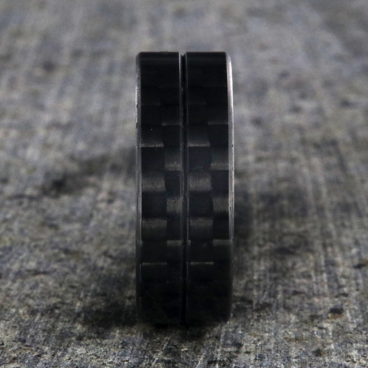 8mm wide black carbon fiber ring with a center groove and flat profile