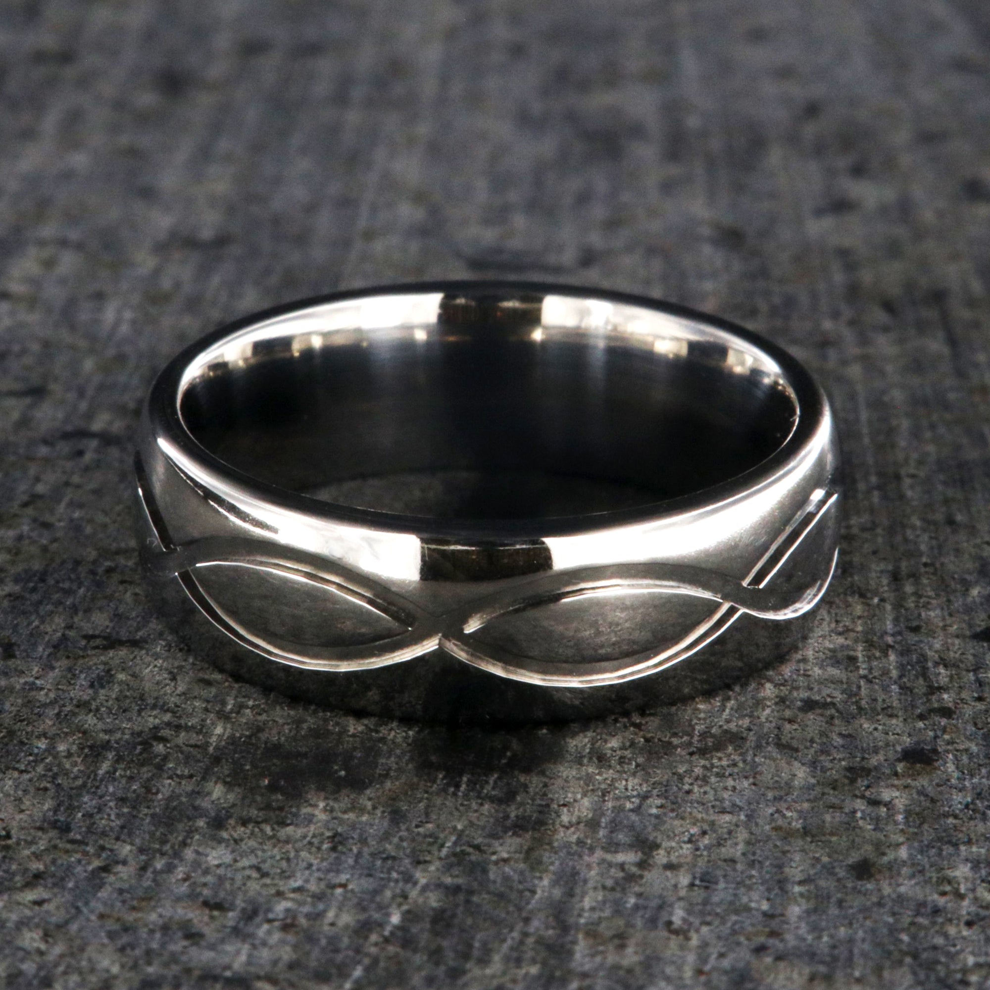 7mm wide infinity titanium wedding band with a rounded profile