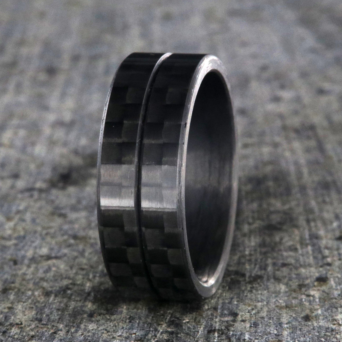 8mm wide black carbon fiber ring with a center groove and flat profile