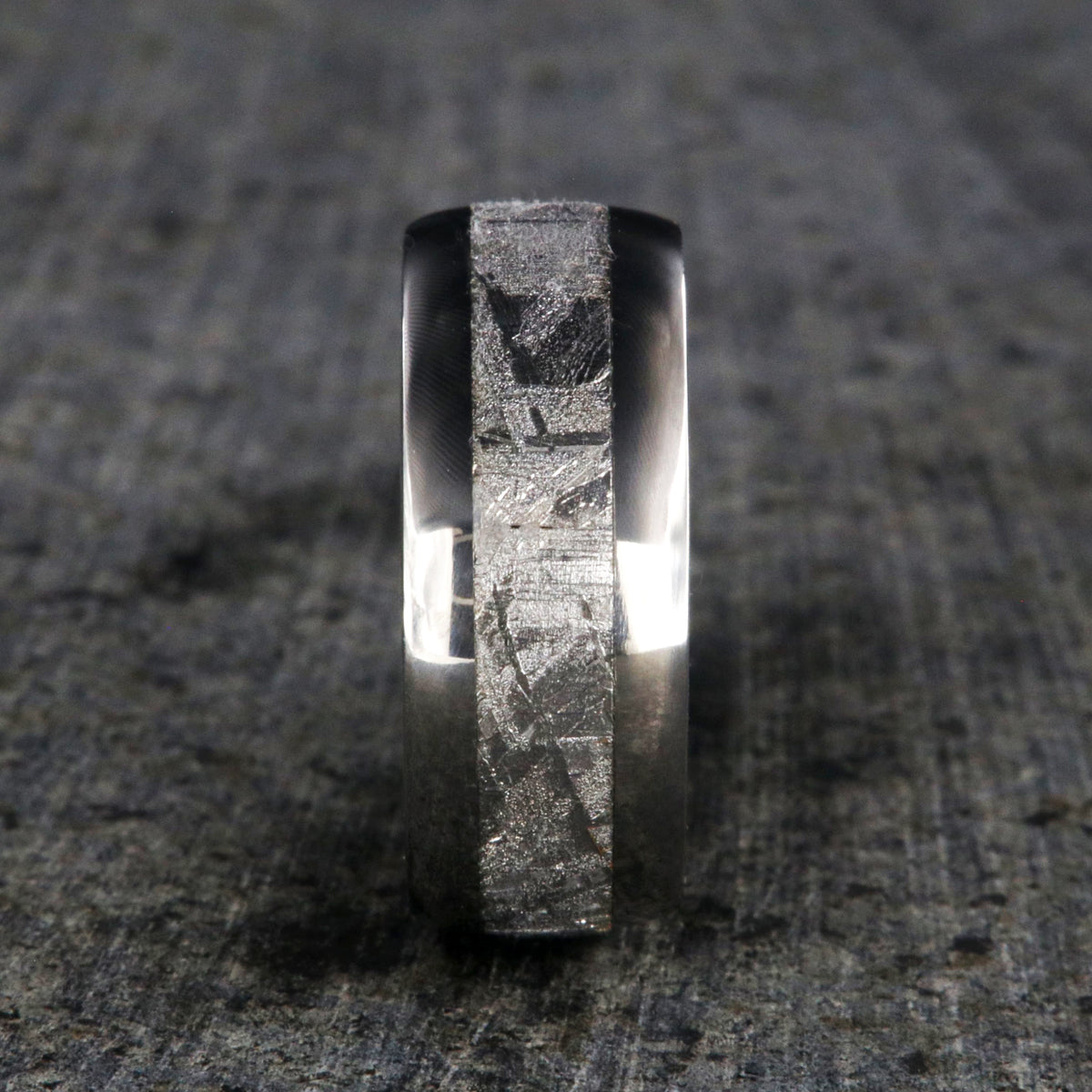 8mm wide Muonionalusta meteorite wedding band with titanium edges and sleeve