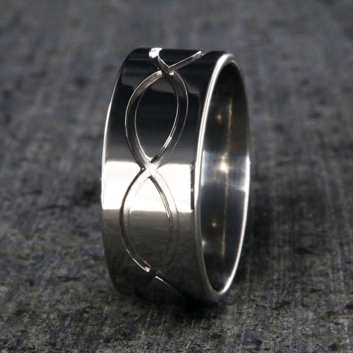 9mm wide titanium wedding band with a milled infinity design and flat profile