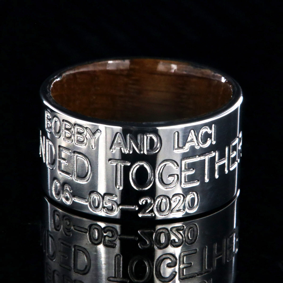 12mm wide titanium wedding band, duck band, 3 lines of custom text and a polished whiskey barrel sleeve