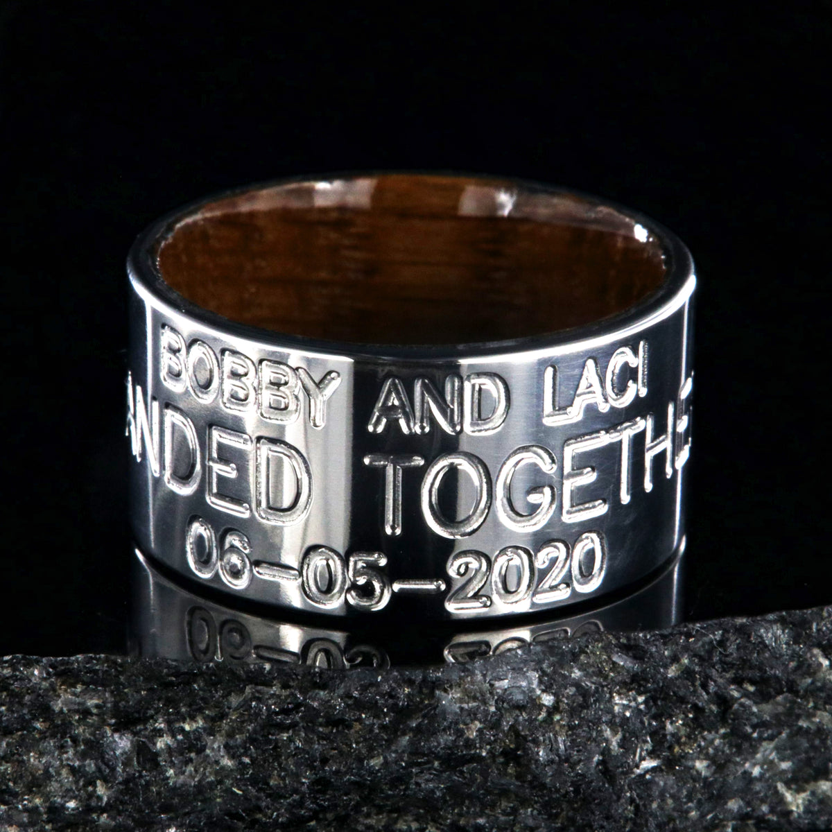 12mm wide titanium wedding band, duck band, 3 lines of custom text and a polished whiskey barrel sleeve