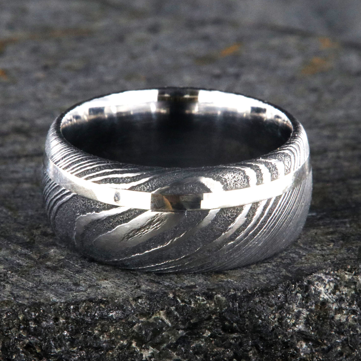 10mm wide men&#39;s Damascus steel wedding band with off-center white gold inlay