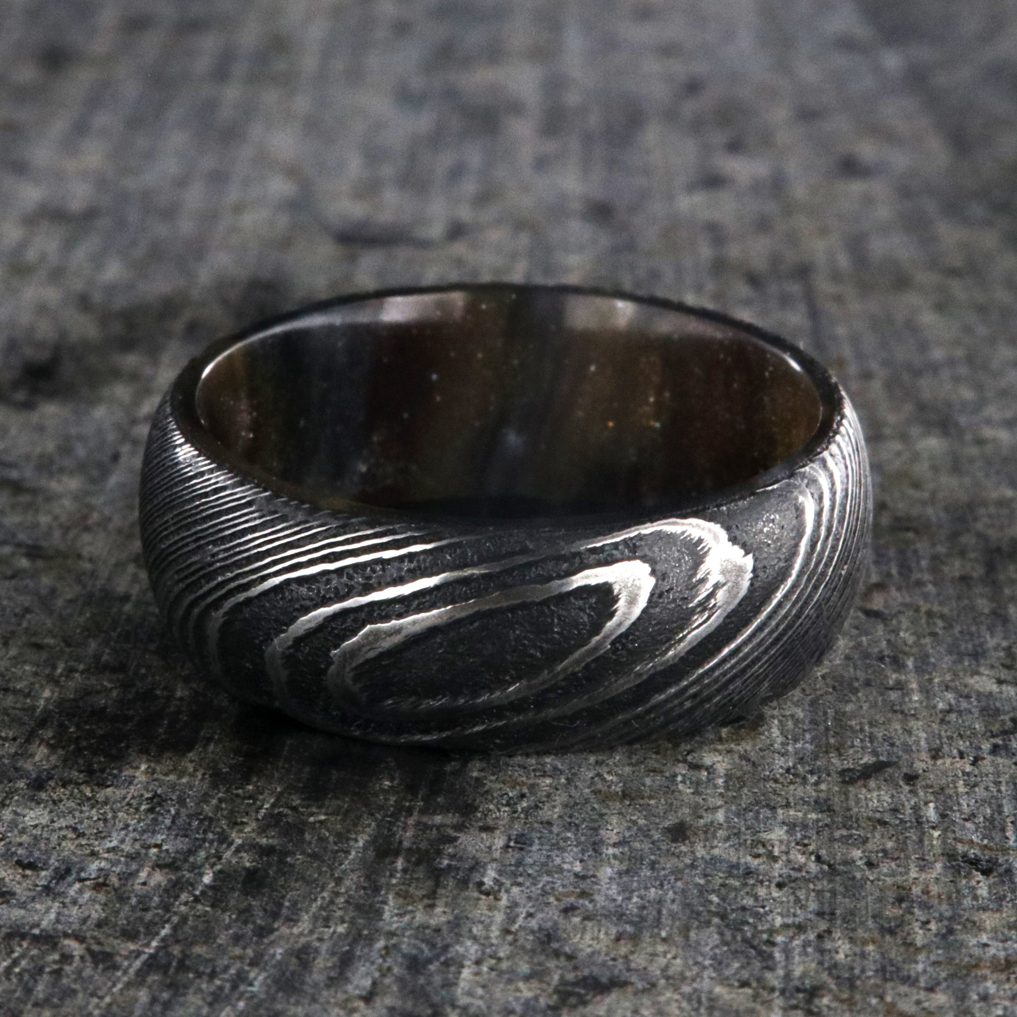 8mm wide Damascus steel ring for me with a copper and brown glittered sleeve