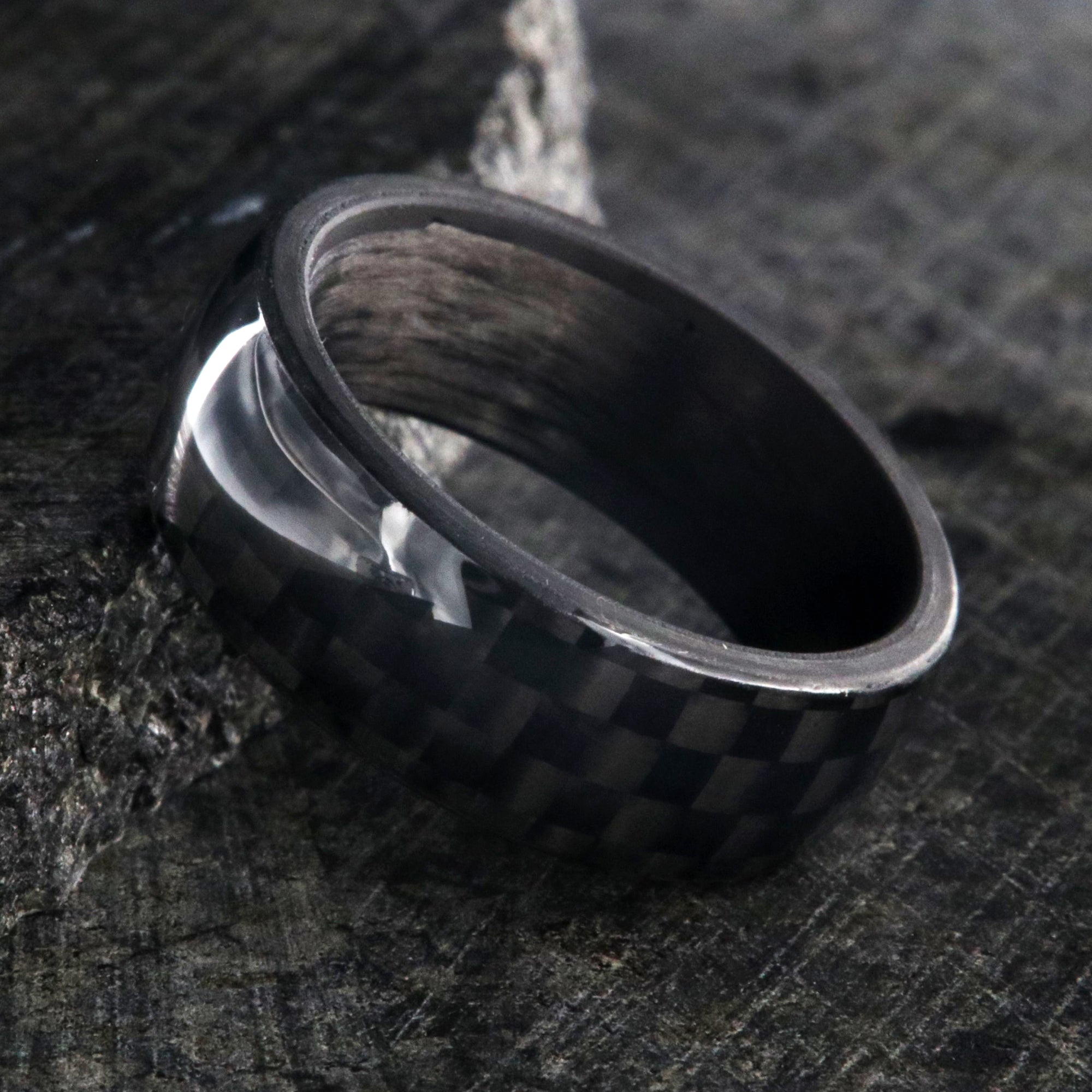 8mm wide black carbon fiber ring with a rounded profile