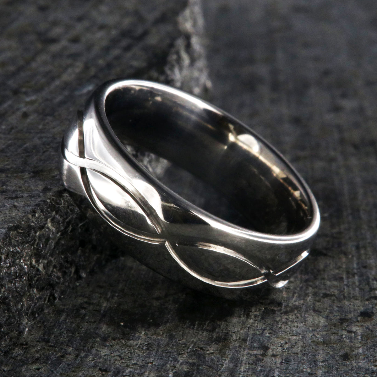 7mm wide infinity titanium wedding band with a rounded profile