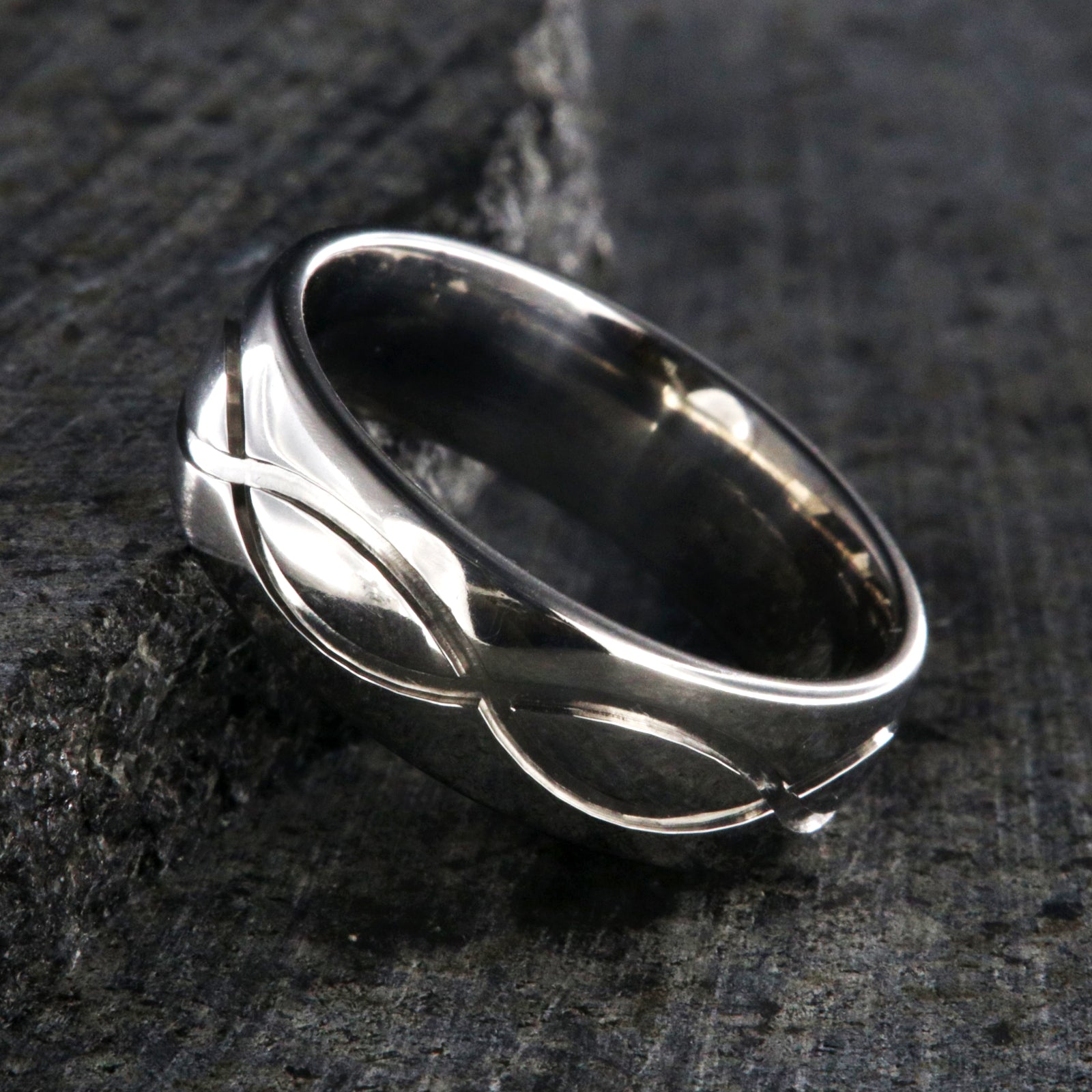 7mm wide infinity titanium wedding band with a rounded profile