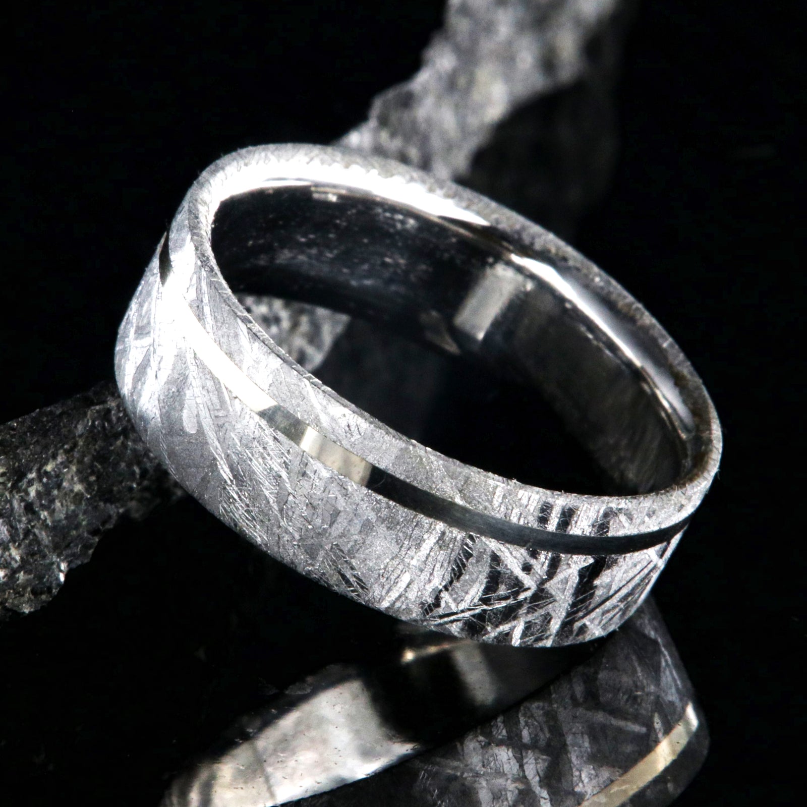 8mm wide men's meteorite wedding band with an off-centered white gold inlay, polished cobalt sleeve, and flat profile