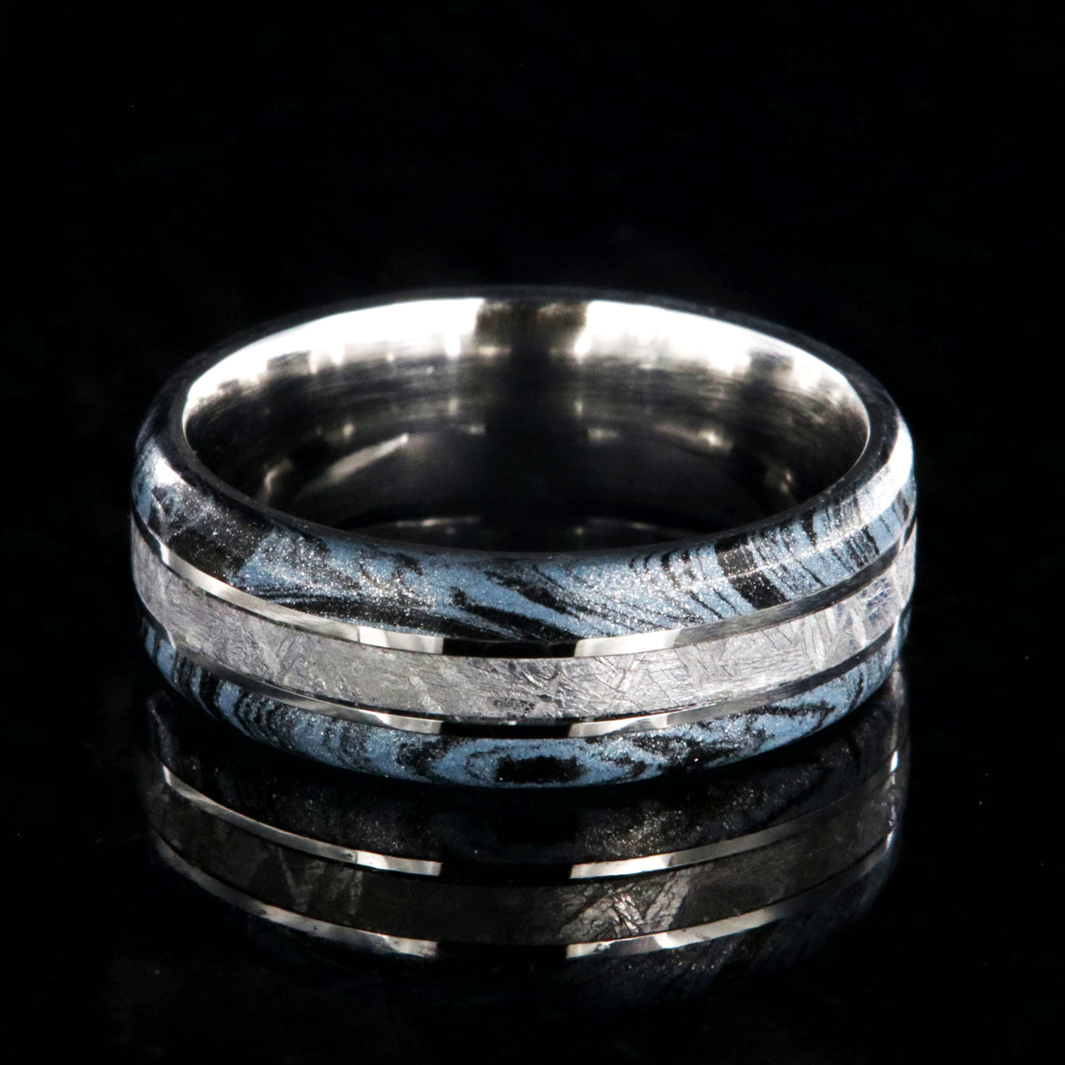 8mm wide cobalt ring for men with Gibeon meteorite center inlay and black and blue cobaltium mokume edges