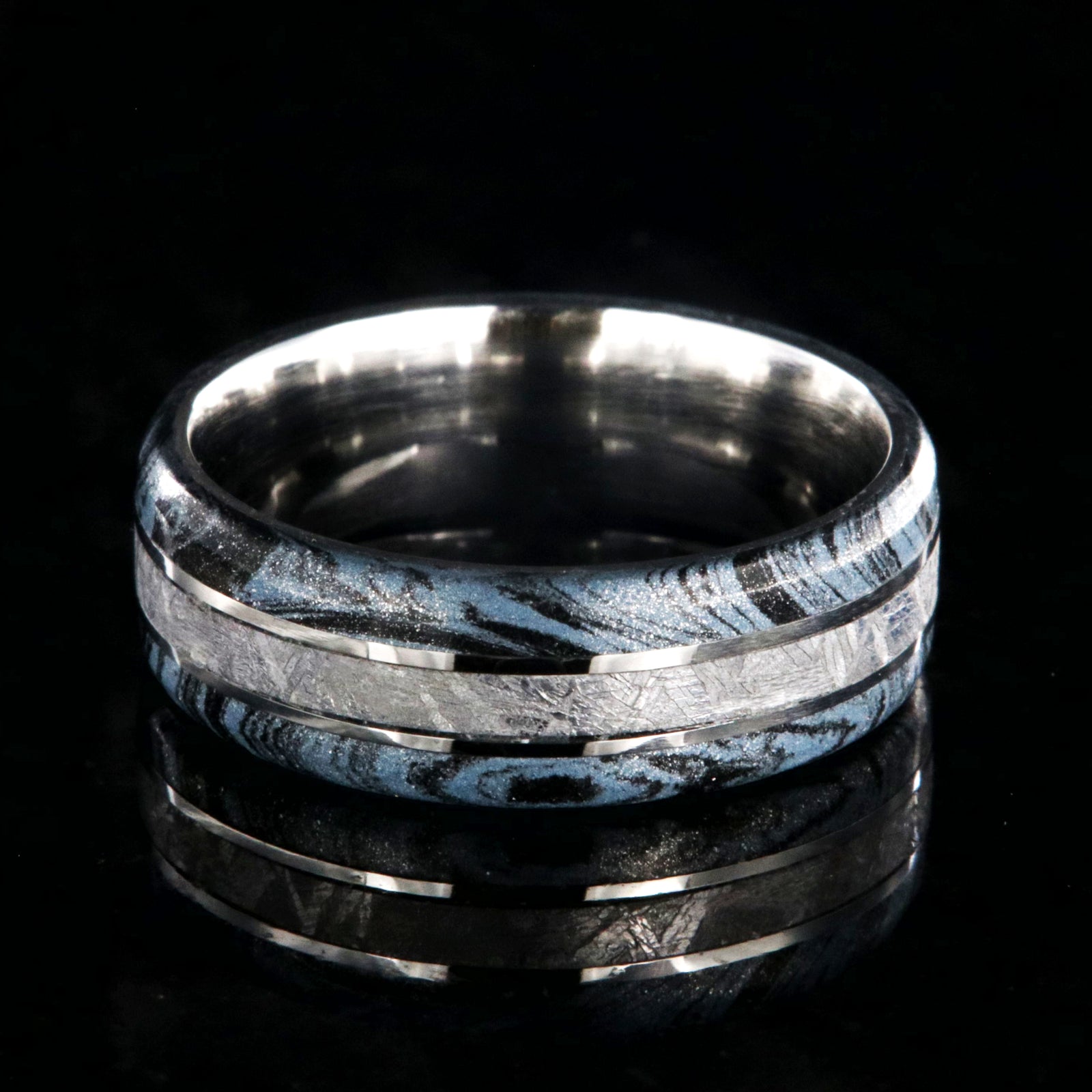 8mm wide cobalt ring for men with Gibeon meteorite center inlay and black and blue cobaltium mokume edges