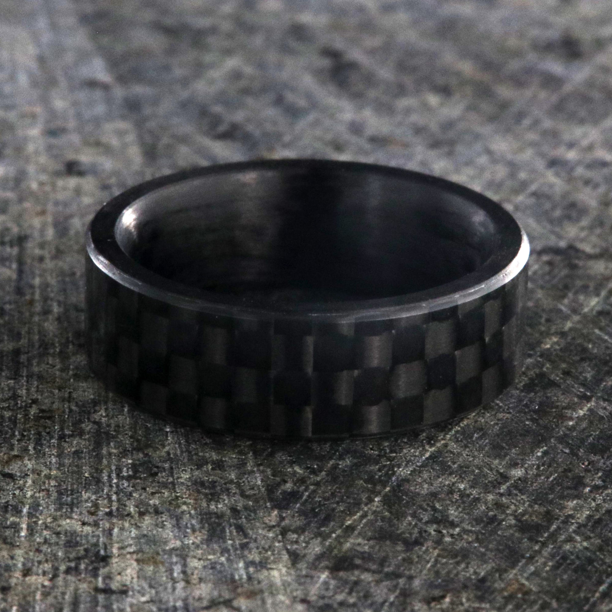 7mm wide black carbon fiber ring with a flat profile