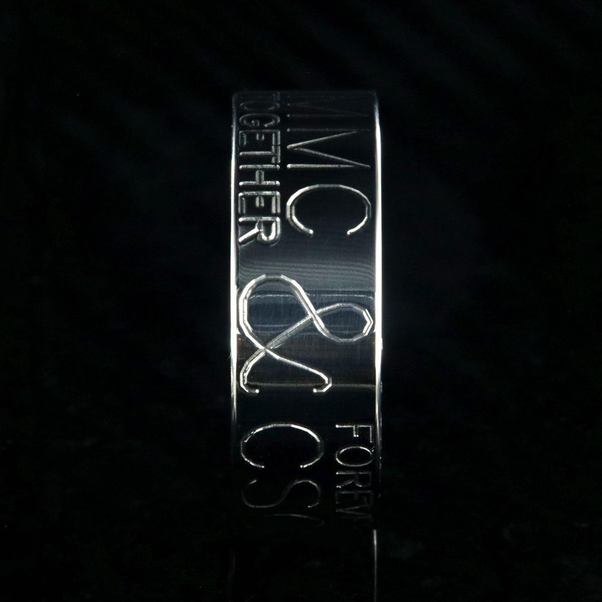 8mm wide personalized duck band ring; polished titanium with two lines of text on either side of an &amp;; polished Jack Daniel&#39;s whiskey barrel sleeve