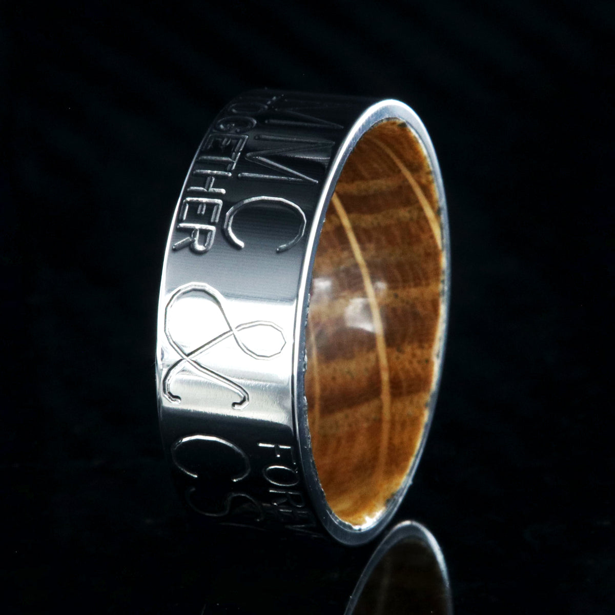8mm wide personalized duck band ring; polished titanium with two lines of text on either side of an &amp;; polished Jack Daniel&#39;s whiskey barrel sleeve