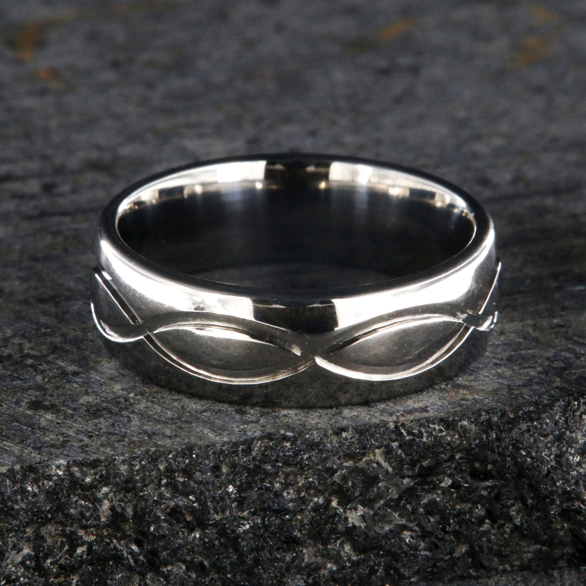 7mm wide infinity titanium wedding band with a rounded profile