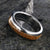 6mm wide wedding band with a whiskey barrel inlay and titanium edges and a rounded profile