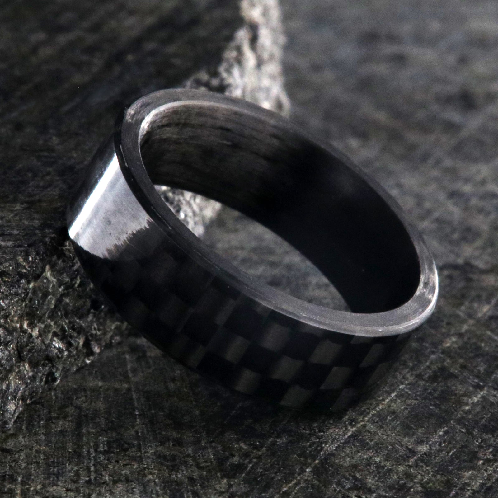 7mm wide black carbon fiber ring with a flat profile