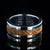 8mm wide wedding band with titanium edges and a whiskey barrel sleeve