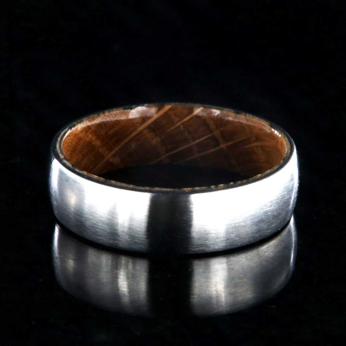 6mm wide cobalt wedding ring with a brushed finish and a Jack Daniel&#39;s whiskey barrel sleeve