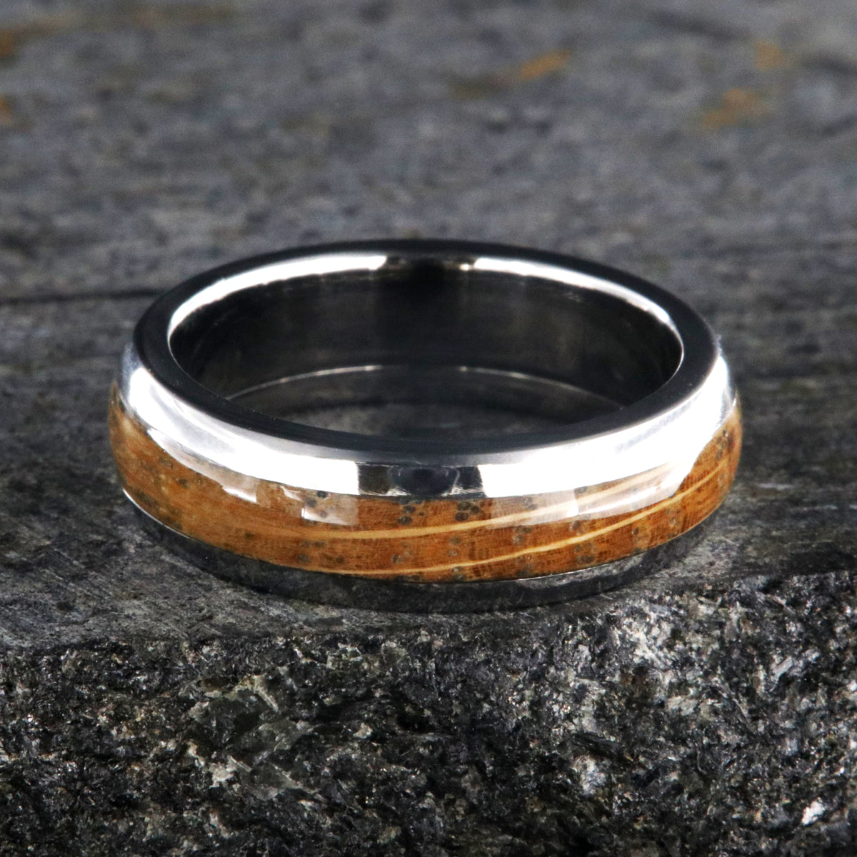 6mm wide wedding band with a whiskey barrel inlay and titanium edges and a rounded profile