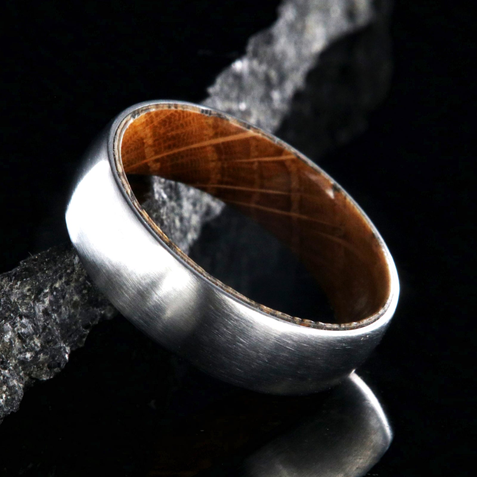 6mm wide cobalt wedding ring with a brushed finish and a Jack Daniel's whiskey barrel sleeve