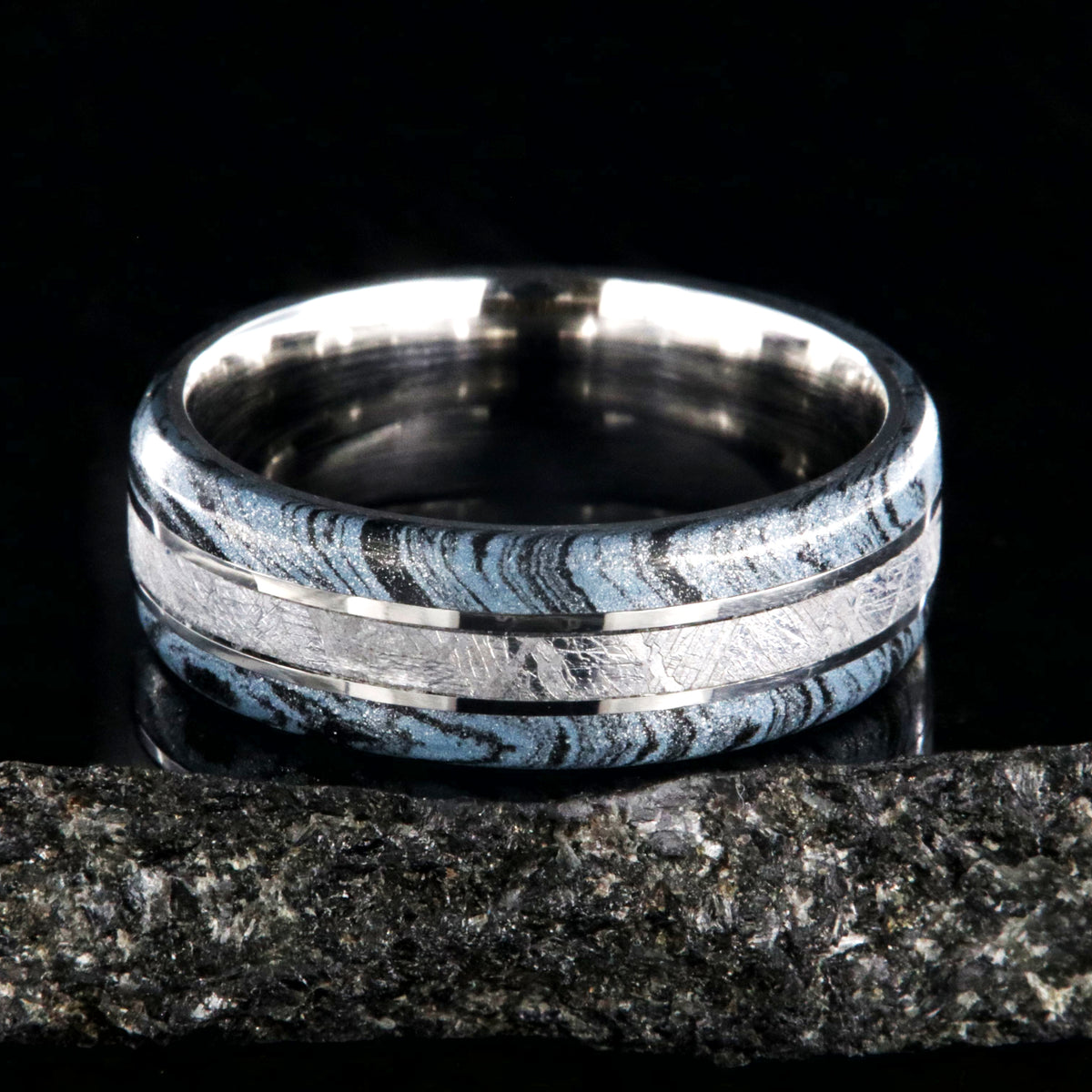 8mm wide cobalt ring for men with Gibeon meteorite center inlay and black and blue cobaltium mokume edges