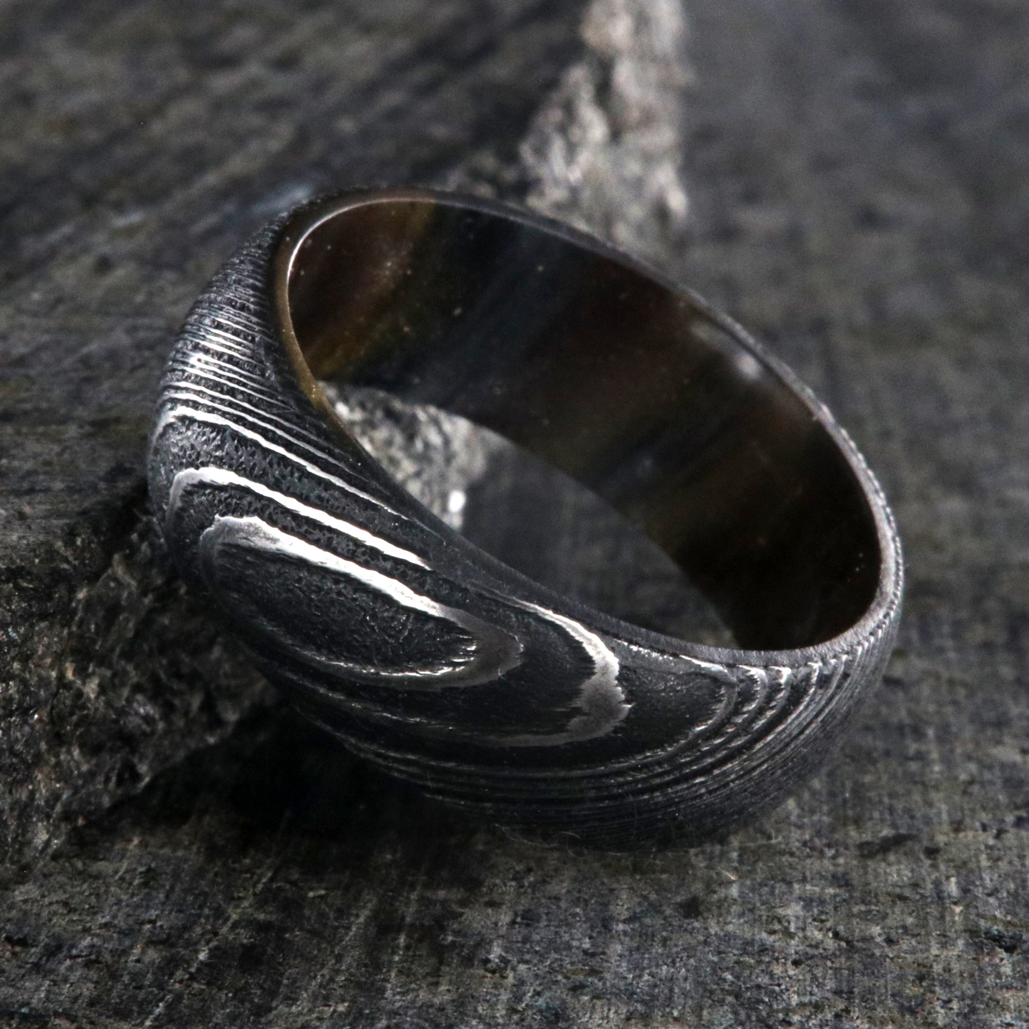 8mm wide Damascus steel ring for me with a copper and brown glittered sleeve