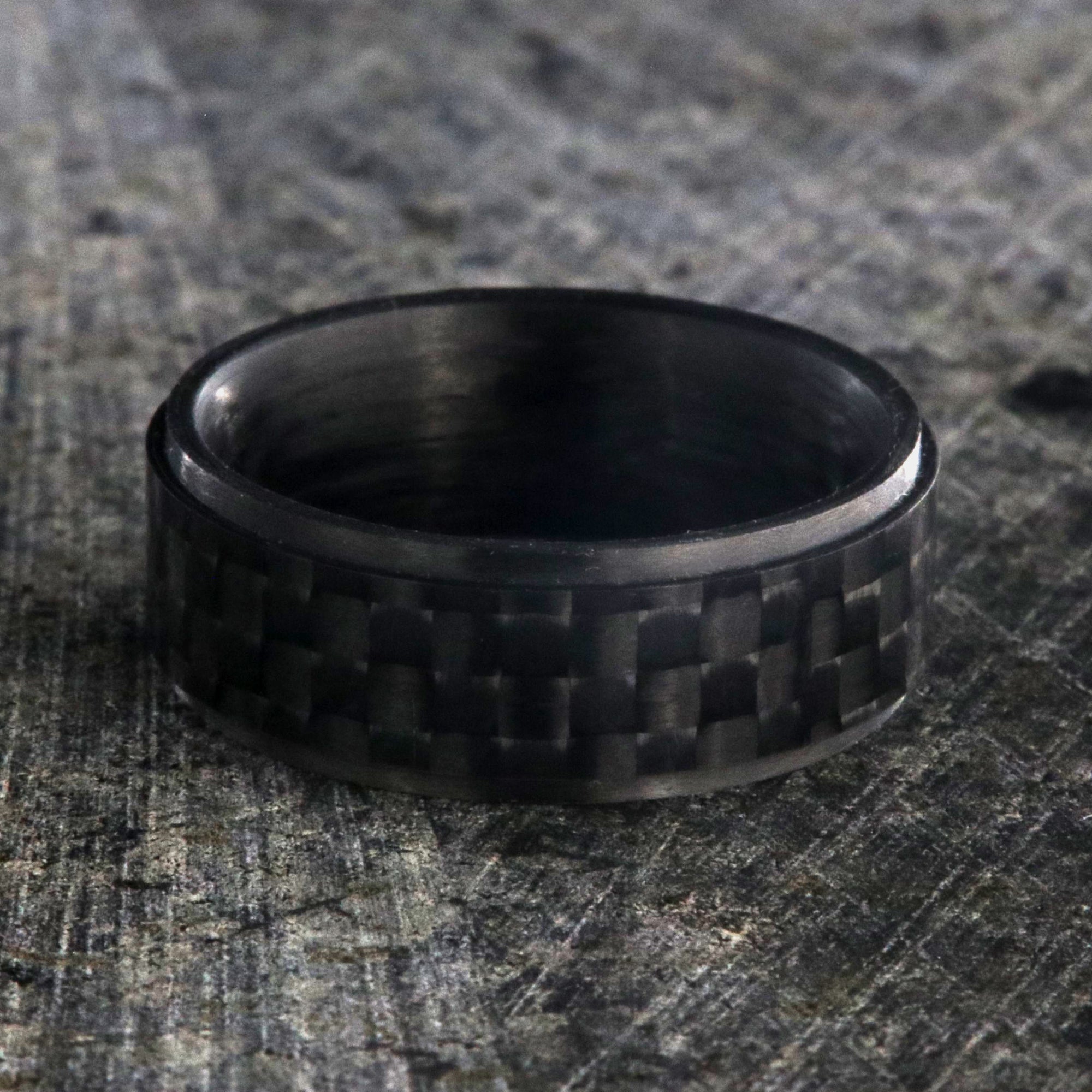 8mm wide black carbon fiber ring with a raised center and flat profile