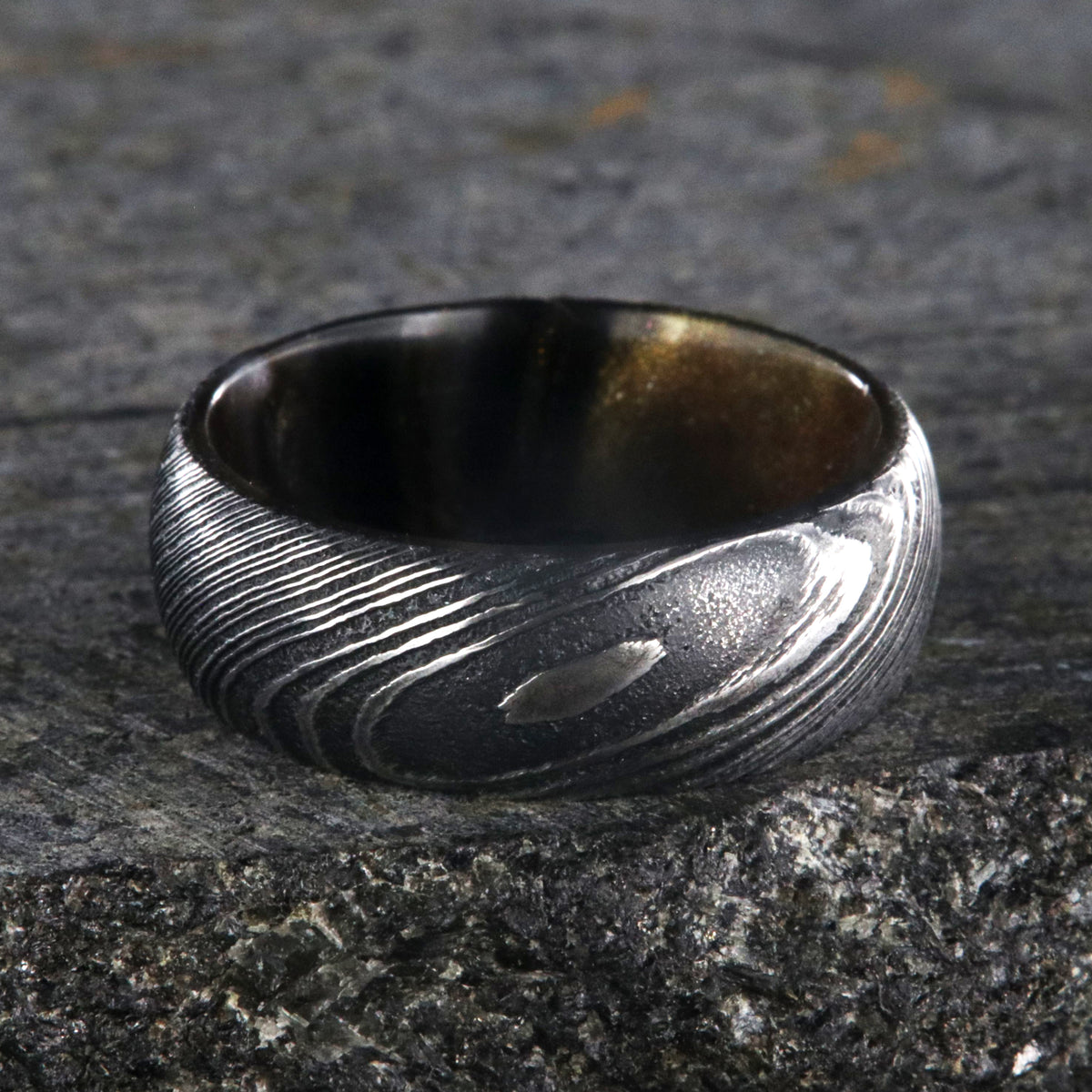 8mm wide Damascus steel ring for me with a copper and brown glittered sleeve