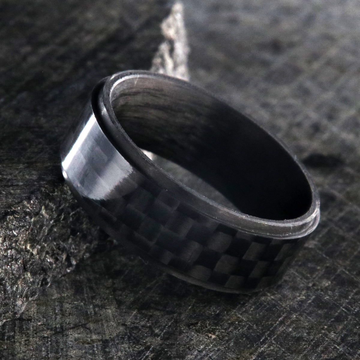 8mm wide black carbon fiber ring with a raised center and flat profile