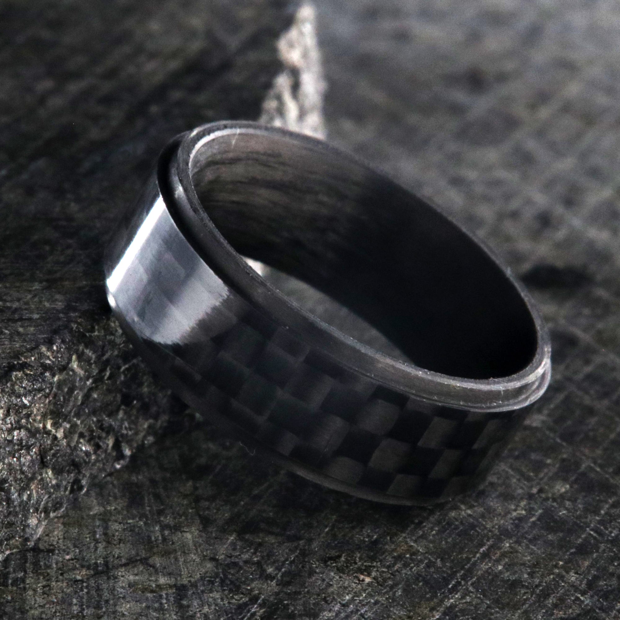 8mm wide black carbon fiber ring with a raised center and flat profile