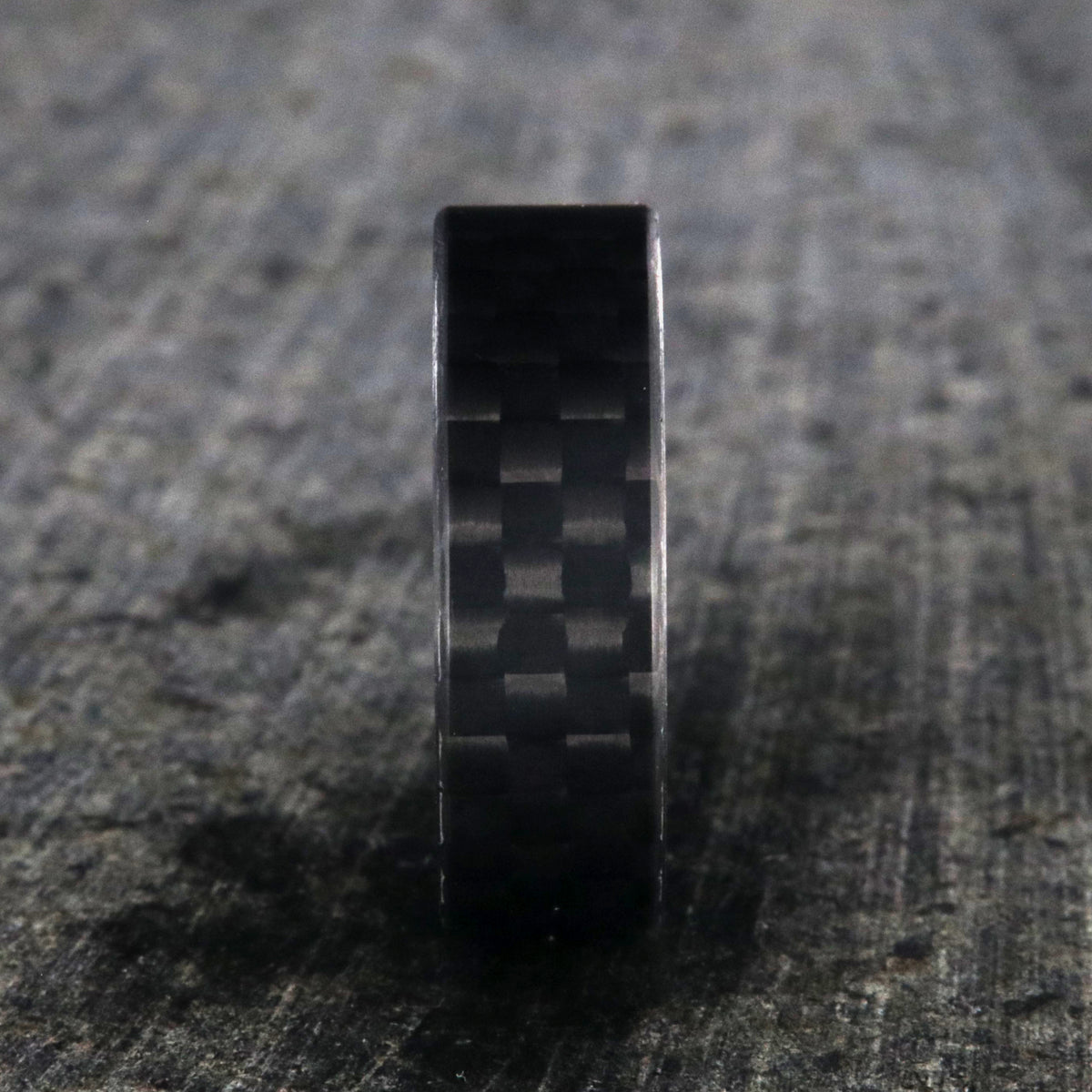 7mm wide black carbon fiber ring with a flat profile
