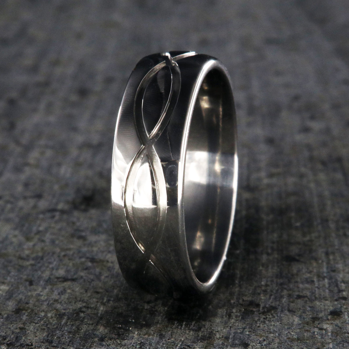 7mm wide infinity titanium wedding band with a rounded profile
