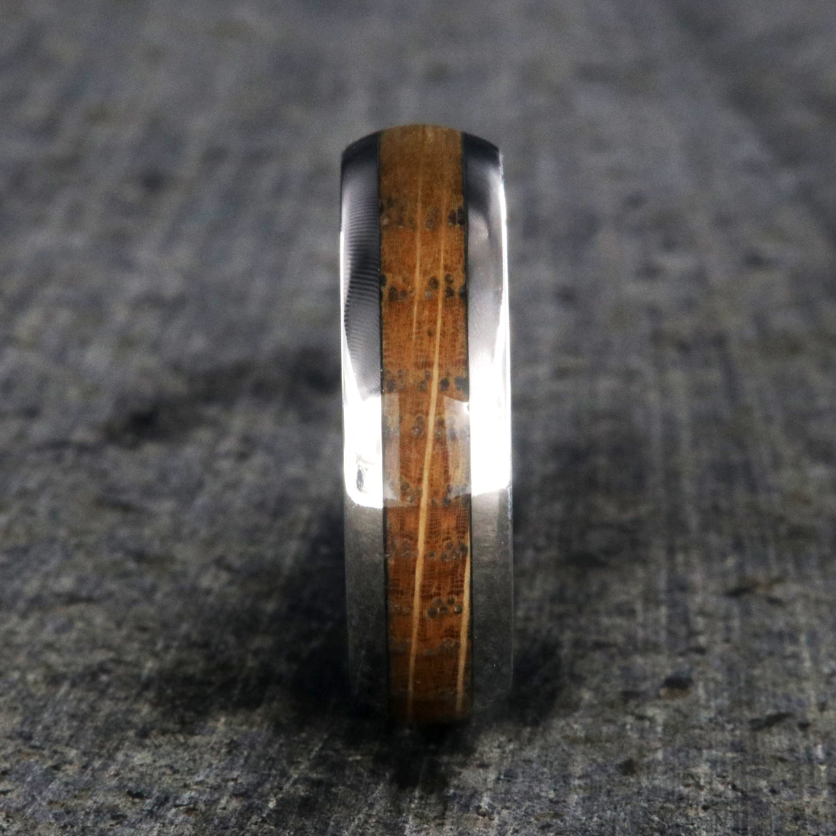 6mm wide wedding band with a whiskey barrel inlay and titanium edges and a rounded profile