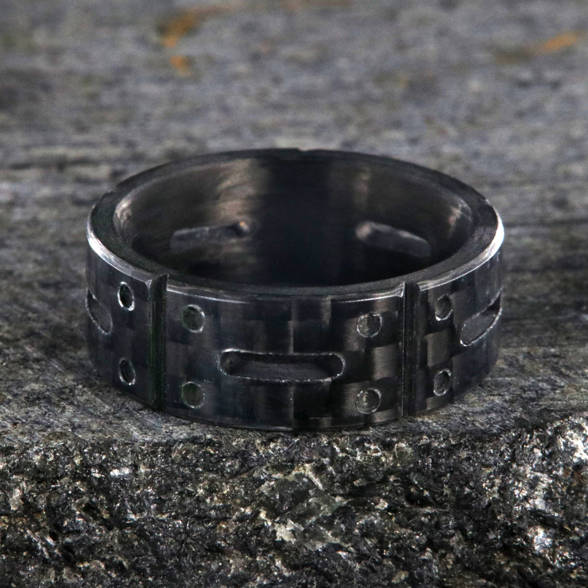 8mm wide black carbon fiber ring with a carved matrix pattern