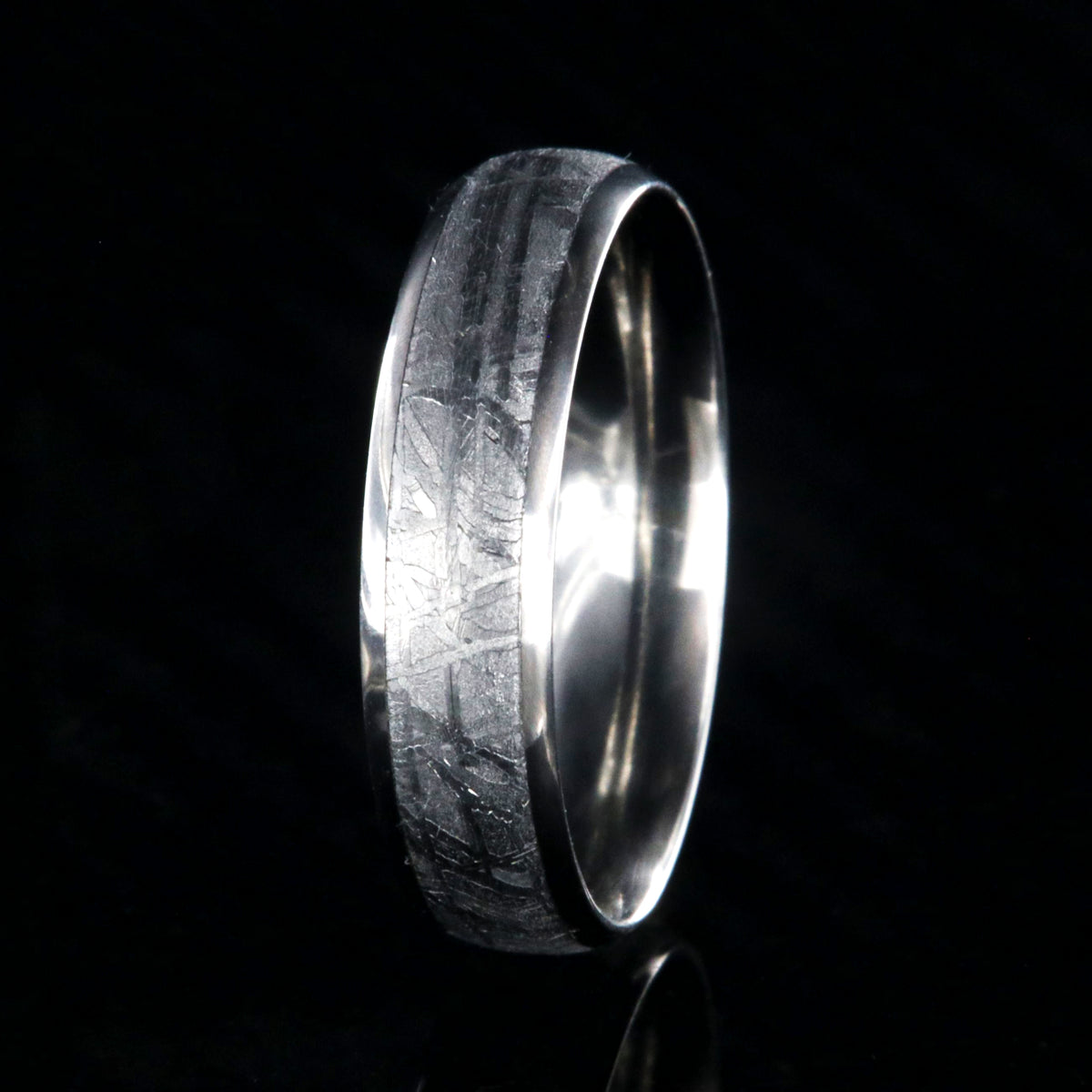 6mm wide meteorite ring with rounded profile and titanium edges and sleeve