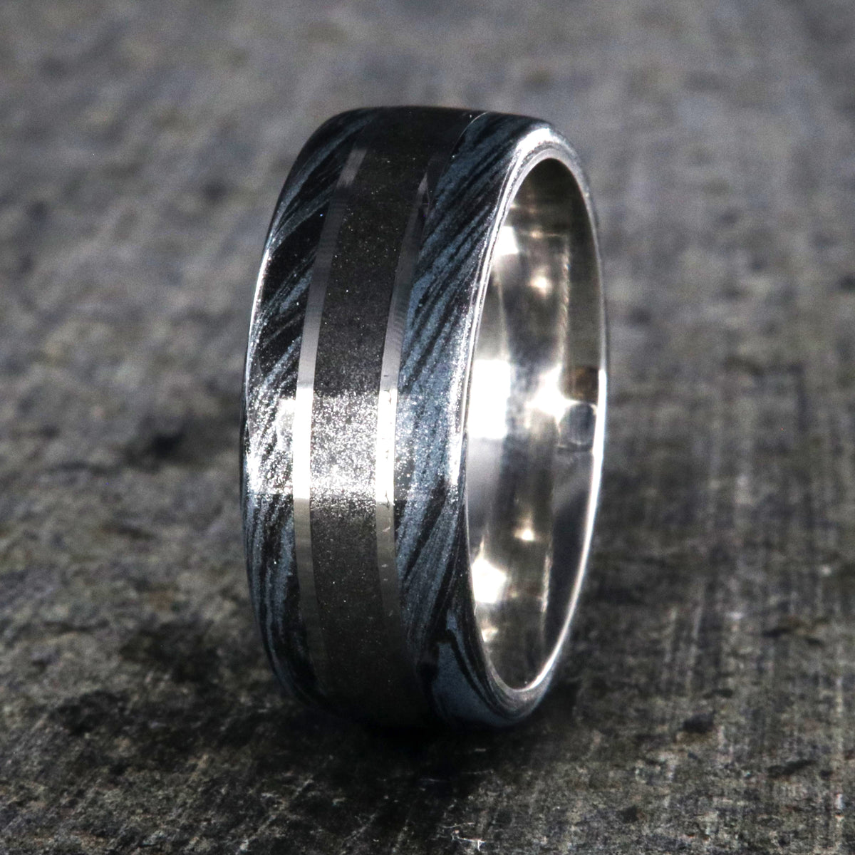 9mm wide stardust center ring with blue and black swirled cobaltium mokume edges