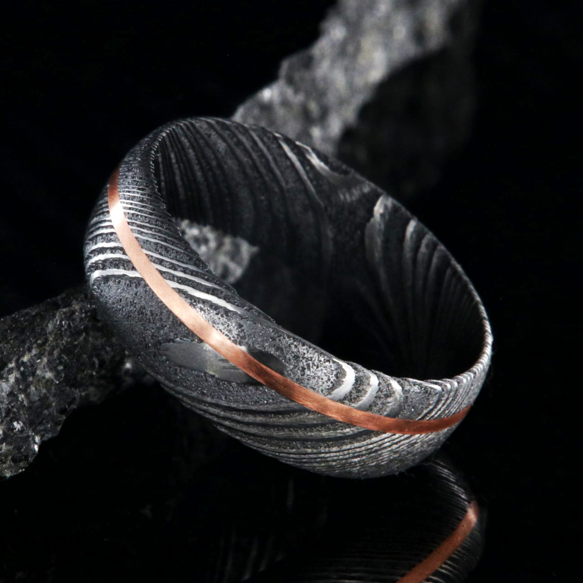 7mm wide Damascus steel ring with copper inlay
