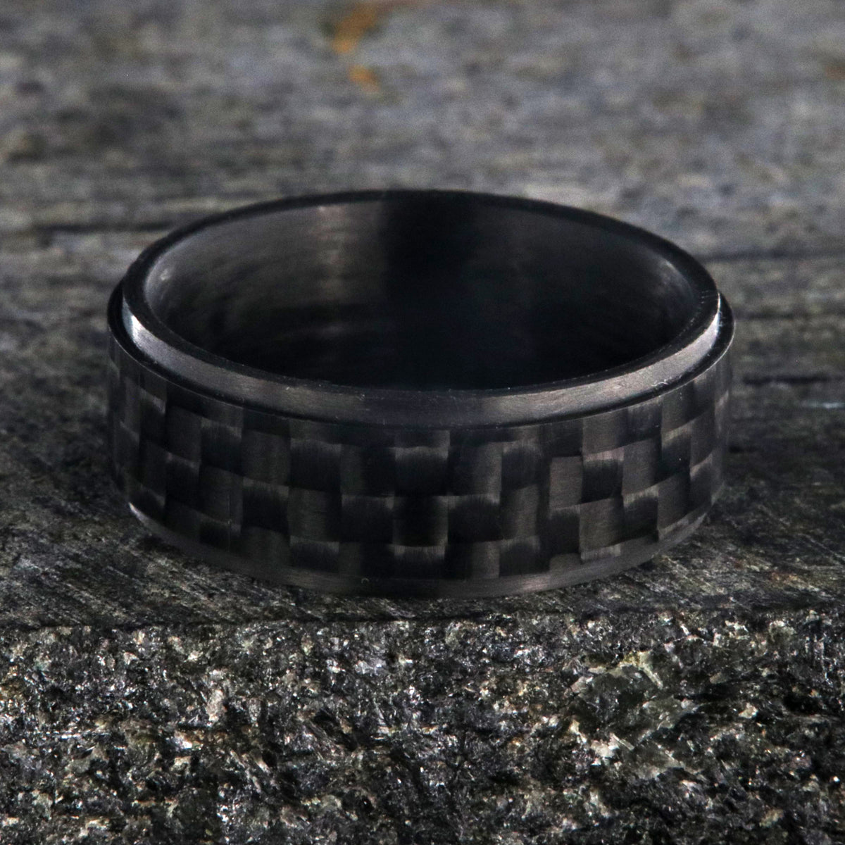 8mm wide black carbon fiber ring with a raised center and flat profile