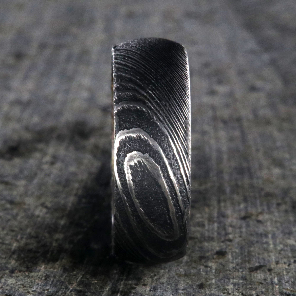 8mm wide Damascus steel ring for me with a copper and brown glittered sleeve