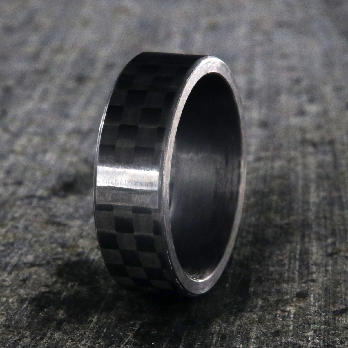 7mm wide black carbon fiber ring with a flat profile