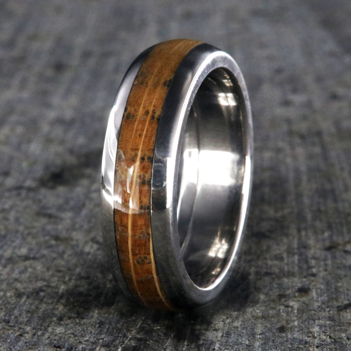 6mm wide wedding band with a whiskey barrel inlay and titanium edges and a rounded profile