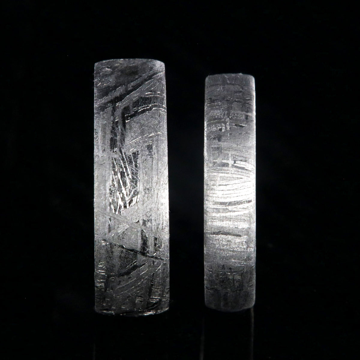 His and her matching ring set with a 7mm wide and 5mm wide Gibeon meteorite rings