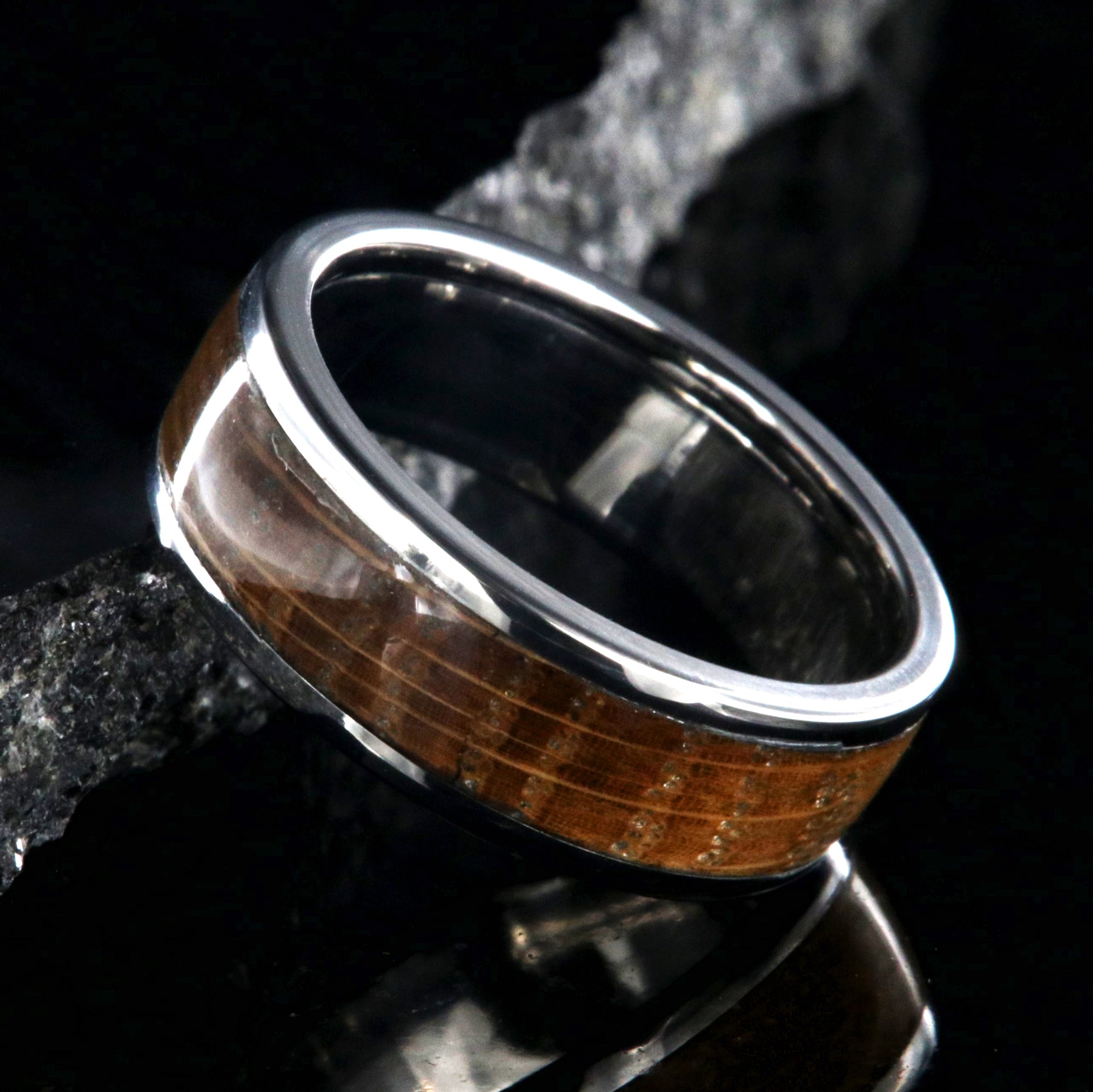 7mm wide wedding band with titanium edges and a whiskey barrel sleeve