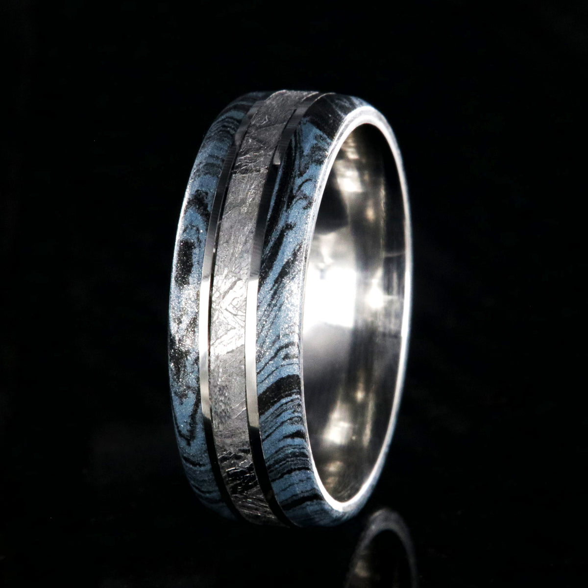 8mm wide cobalt ring for men with Gibeon meteorite center inlay and black and blue cobaltium mokume edges