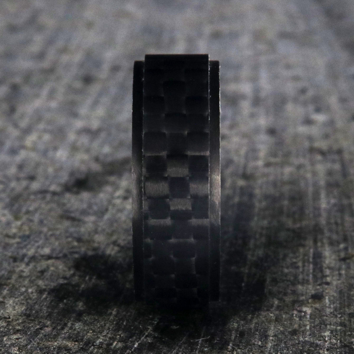 8mm wide black carbon fiber ring with a raised center and flat profile
