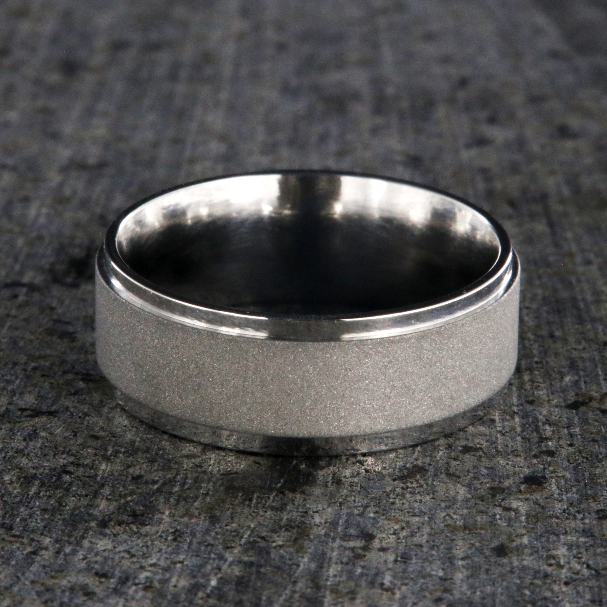 8mm wide cobalt wedding band with a raised-center and sandblasted finish