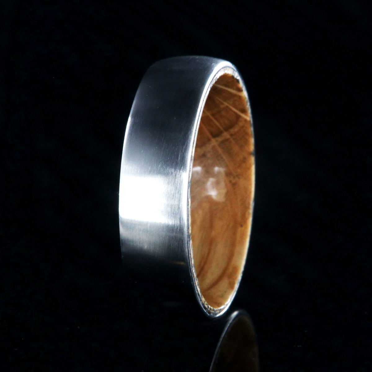 6mm wide cobalt wedding ring with a brushed finish and a Jack Daniel&#39;s whiskey barrel sleeve