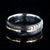 7mm wide black Damascus steel wedding band with a centered yellow gold inlay and a rounded profile